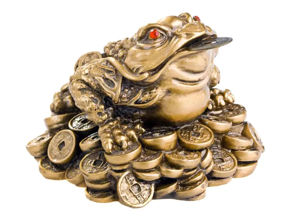This is the Chinese Feng Shui frog statuette with coins for prosperity.