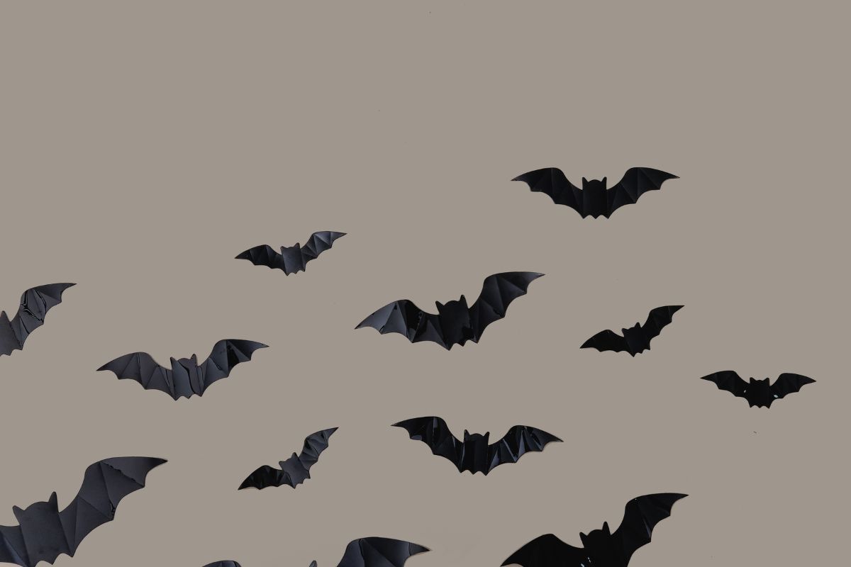 Black bats on brown background.